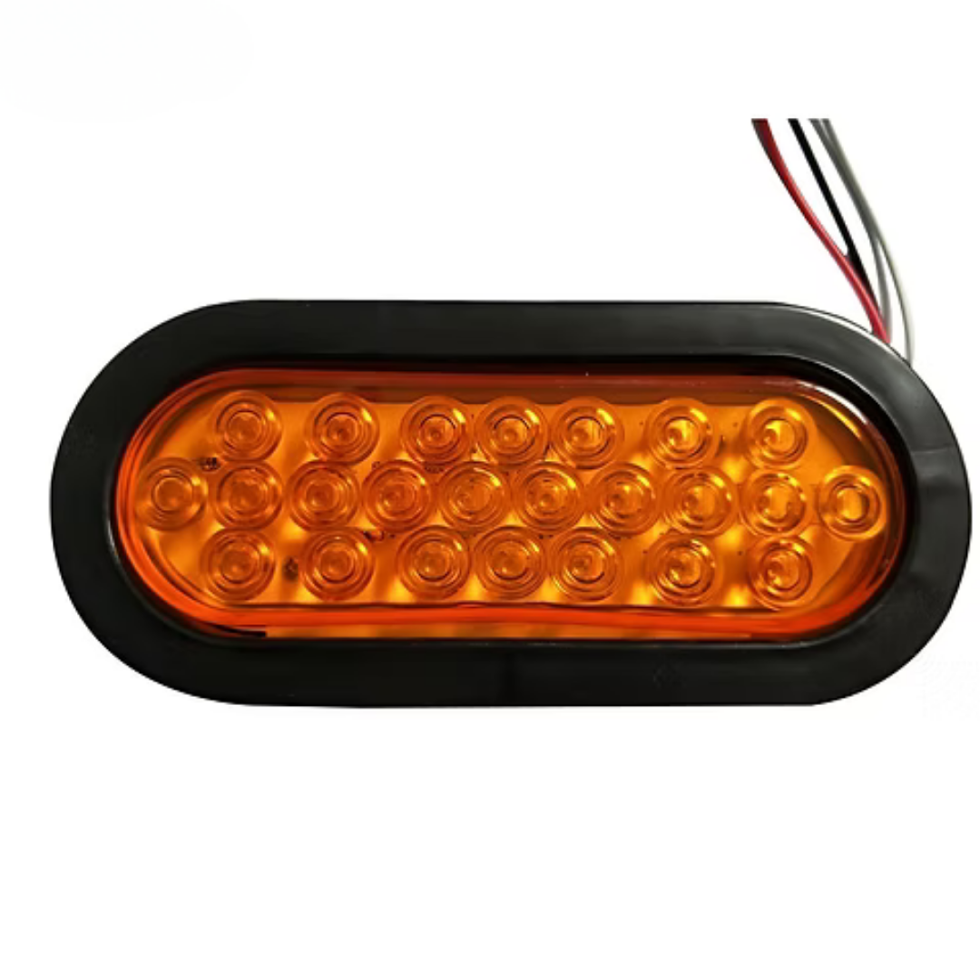 FOCO 24 LED AMBAR MULTIVOLTAJE OVALADO CON ARO DE GOMA